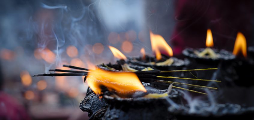 Butter lamps and incense burning at an Hindu ceremony