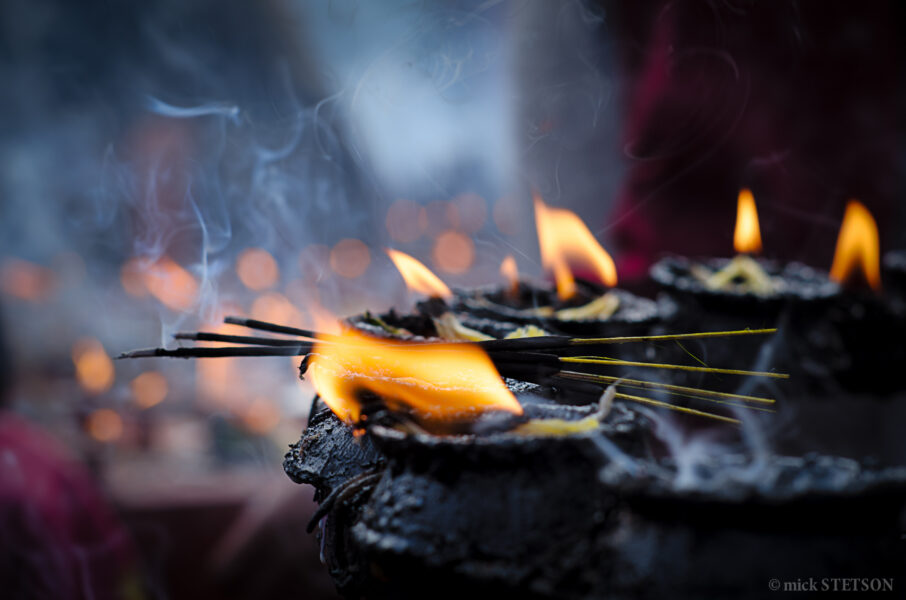 Butter lamps and incense burning at an Hindu ceremony