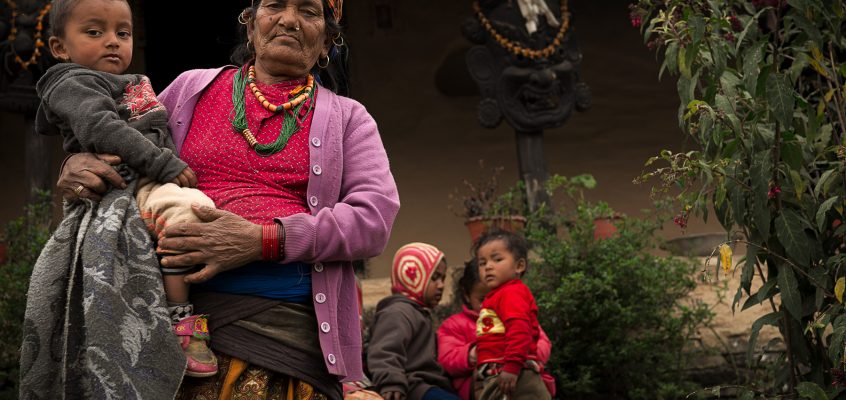 Gurung villager taking care of children while their mothers are farming or gathering food.