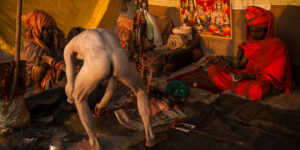 A brahmin priest and his initiates at the Kumbha Mela festival in India.