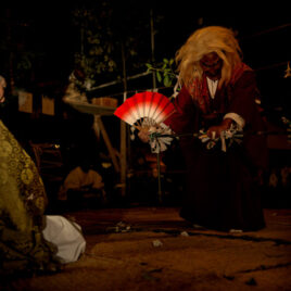 A Shinto god dances for the community elders of this small farming village