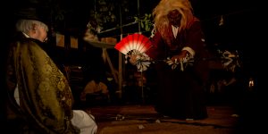 A Shinto god dances for the community elders of this small farming village