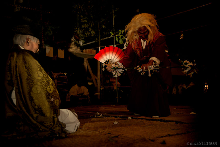A Shinto god dances for the community elders of this small farming village