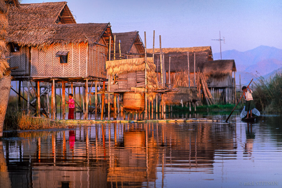 Stilt houses and floating fields line the waterways of Ywama village on Inle Lake.